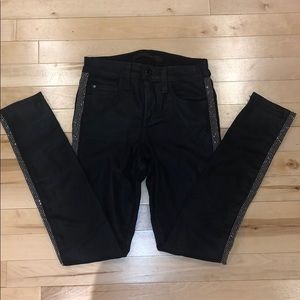 Crystal studded coated black jean.